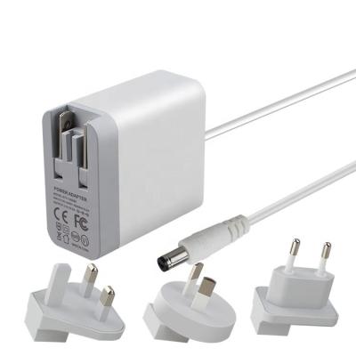 China To UK AC DC Plug Power Supply Adapter Interchangeable US Detachable Eu 24w 12v 2a Plug Power Adapter 75*40*30mm for sale