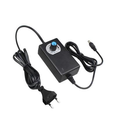 China Universal AC/DC Adapter 3-12v 2a 1a AC DC Power Supply Adjustable 24v 85x46x30mm for sale