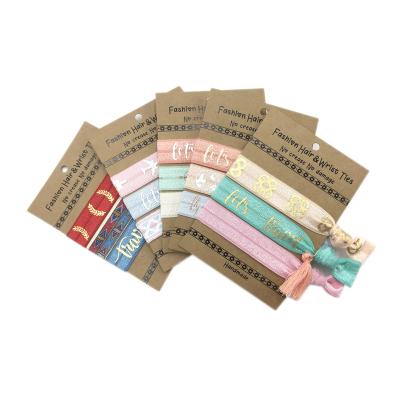 China Hair Tie 100 Bundles / Lot Hair Ties With Card Wholesale Compass Airplane Bracelet Tassel Charm Girls Hair Band Elastic Hair Band Ponytail Holder for sale