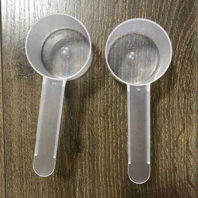 China Viable Plastic Sugar Flour Scoop Accessories Promotional Kitchen 45G Measuring Cup 90ml Doser Milk Powder Spoon Coffee Tool for sale