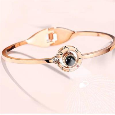 China 100 LANGUAGES Stainless Steel Woman Valentine Bracelet Environmental Friendly Fashion Lettering I Love You Bracelets For Girls for sale