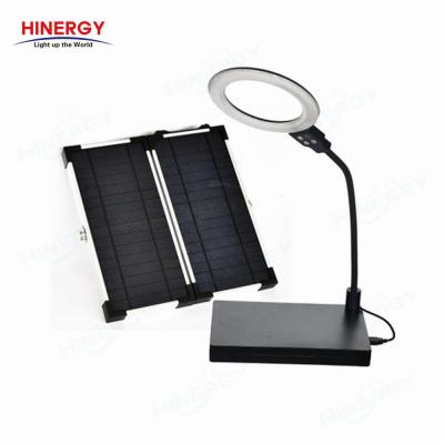 China Lithium Battery Mini Solar Lighting System Book Indoor Rechargeable Portable Light For Home for sale