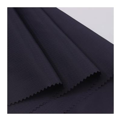 China Hot Sale 70D 210T 0.3CM Waterproof Nylon Taffeta Fabric 100% Ripstop Recycle Nylon Fabric For Outdoor Jacket Use for sale