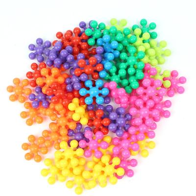 China Children's Toys Plastic Interlocking Discs Stem Toys Plum Blossom Shaped Block Building Educational Connecting Snowflake Building Blocks Play for sale