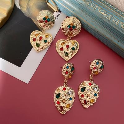 China Palace Environmentally Friendly Wholesale Retro Silver Color Bas Relief Gold Simple Heart 925 Needle Earrings for sale