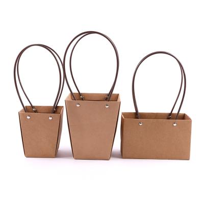 China Wholesale Eco-Friendly Portable Flower Arrangement Tote Bag Paper Craft, Recyclable Plant Bouquet Bags For Flowers Packaging PVC Handle for sale