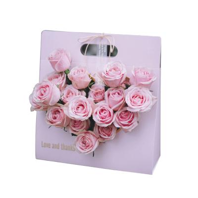 China Wholesale Custom Folding Rose Flower Bouquet Packaging Wrapping Portable Fresh Dry Carry Bag Recyclable Plant Paper With Handle for sale