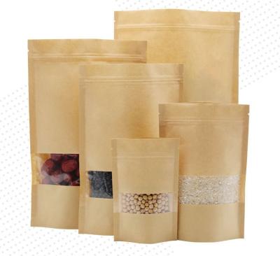 China Stand Up Moisture Proof Brown Recycled Paper Kraft Paper Food Bag Zipper Candy Bag With Clear Window for sale