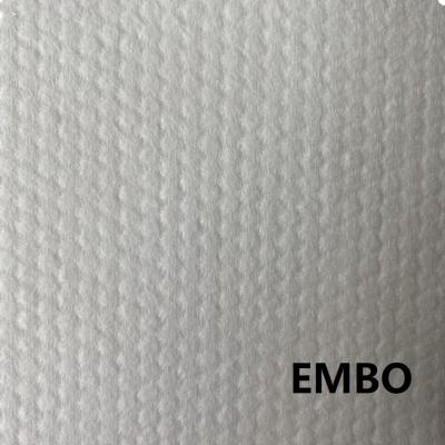 China Small stitch embo100% spunlace viable viscose lap cross 75gsm nonwoven rolls made in China for sale