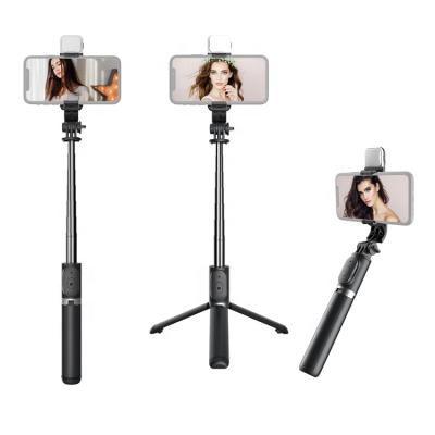 China Hot Amazon 360 Degree Rotation LED Fill Light Wireless Mini Selfie Stick With Light 360 Degree Rotation Tripod for sale