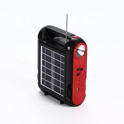 China New outdoor camping FM radio or emergency TF card audio outdoor camping solar lamp spotlight flashlight with BT speaker for sale