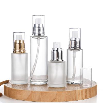 China Wholesale 20ml 30ml 40ml 50ml 60ml 80ml 100ml Cosmetic Clear Frosted Glass Bottle With Sliver Gold Spray Lotion Pump for sale