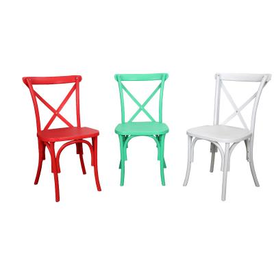 China Modern hot sale modern stackable plastic pp resin white and colorful cross back chair for wedding party events for sale