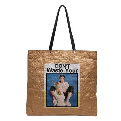 China Large capacity retro bag recyclable waterproof custom logo packaging paper grain washing portable creative environmental protection shoulder bag for sale