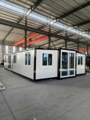 China Aanpasbaar uitbreidbaar dubbel vleugelcontainerhuis met aardbevingsbestendigheid van graad 8 en natuurlijke ventilatiesystemen Te koop