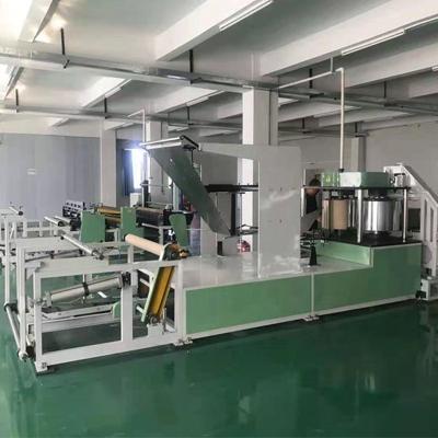 China High Production Efficiency Paper And PE Film Laminated Table Cloth Folding Making Machine for sale