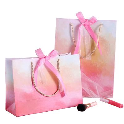 China Wholesale Customized Recyclable Lovely Peach Printed Clothing Packaging Paper Bags Recyclable Pink Wedding Special Days With Handles Gift Box for sale