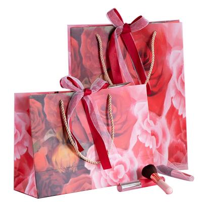 China Recyclable Wholesale Customized Printed Red Rose Sweet Romantic Wedding Apparel Packaging Shopping Paper Bags With Handles Fancy Gift Boxes for sale