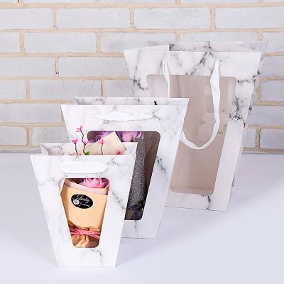 China Creative Waterproof Flower Carry Bag Bouquet Handbag With PVC Paper Transparent Window Customized Disposable Wholesale for sale