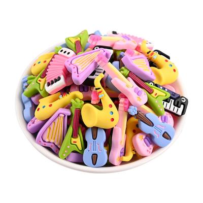 China Japan Artificial Musical Resin Flat Back Cabochon Piano Guitar Accordion Kids Toys Gifts For Ring Jewelry Key Finding for sale