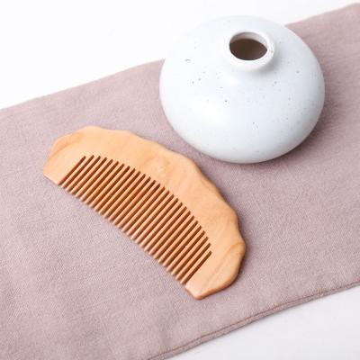 China Cheap Personalized Round Hair Comb Wooden Peach Hair Comb Natural Comfortable/Durable/Anti-Static Hair Comb for sale