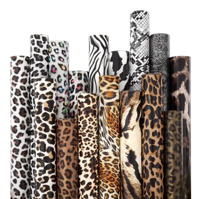 China Wholesale Apparel 10inx50Yard Stretchable PU Easy To Weed HTV Film Leopard Animal Prints Heat Transfer Vinyl Rolls For Textile Garment for sale