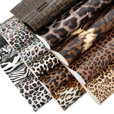 China Custom Stretchable Apparel 10inx50Yard PU Easy To Weed HTV Film Leopard Animal Prints Heat Transfer Vinyl Rolls For Textile Garment for sale