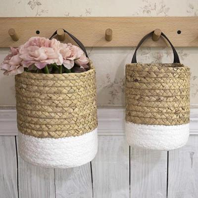 China Minimalist Wall Hanging Flower Basket Customized Wall Hanging Basket Garden Seaweed Woven Hanging Flower Pot Wholesale for sale