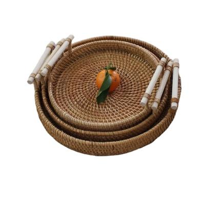 China Wholesale Popular Serving Trays Handwoven Eco Friendly Disposable Rattan Round Rattan Tray Original Dishes and Dishes Rice Dish All-Season for sale