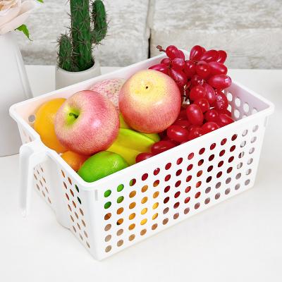 China Sustainable Wholesale PP Material Large Pantry Kitchen Vegetable Storage Hollow Basket With Handle for sale