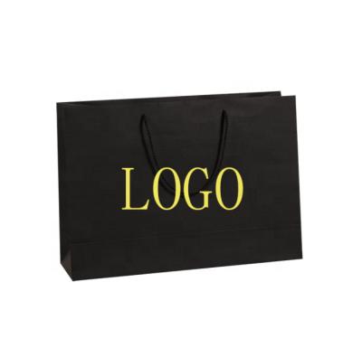 China New Recycled Logo Cotton Rope Handles Hot Foiled Stamping Black Matt Kraft Paper Bag With Materials Gold for sale