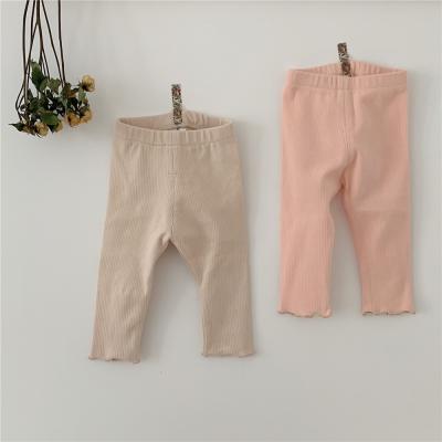 China Fade Proof Autumn Children's Clothing Baby Solid Color Yarn Stretch Girl's Wave Foot Gaiters Long Pants for sale