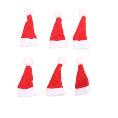 China Nonwoven Fabric Christmas Decoration Supplies Mini Santa Hats Classic Red And White Velvet Santa Hat For Kids And Adults for sale