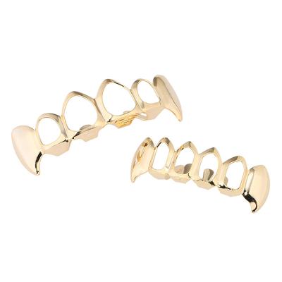 China Other hip hop jewelry top and bottom set 18k gold teeth grillz vampire fangs hollow teeth grillz for sale