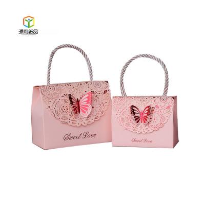 China Wedding Decorative Materials Butterfly Bag Box Candy Recycled Paper Sweet Gift Box With Handle for sale