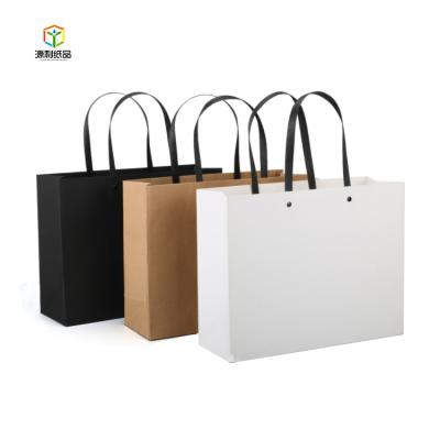 China Recycled Materials Luxury Custom Printed Handle Foldable Kraft Paper Gift Bag Shopping Bags for sale