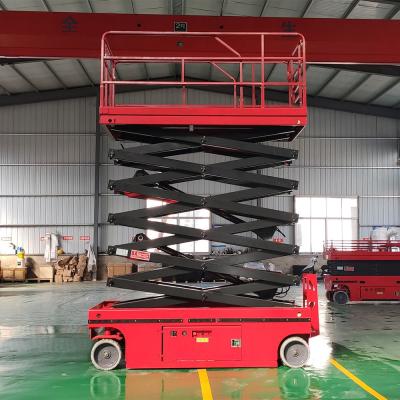 China 320KG 10 Meter Scissor Lift Red Self Propelled Man Lift For Warehouse for sale