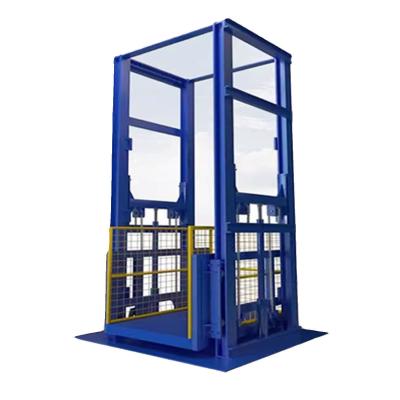 China Blue 3000kgs Warehouse Cargo Elevator 3m-9m Mini Goods Lift for sale