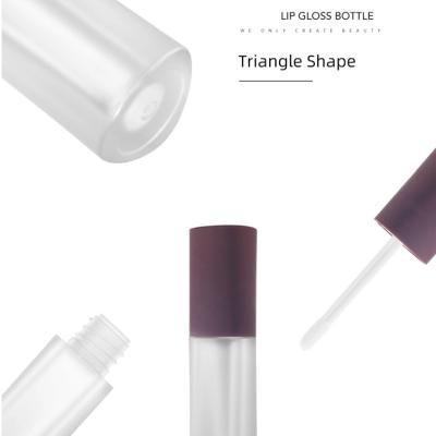 China Cosmetic Nude Pink Lip Gloss Tube Lip Gloss Tubes With Silver Lip Gloss Palm And Top Bookshelf Tubes for sale