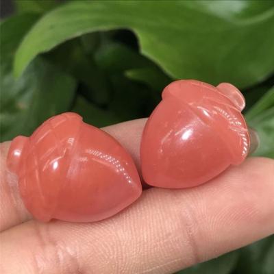 China China Natural Mineral Carving Hazelnut Form Crystal Rhodochrosite Pine Cones Rieki Healing Stone for sale