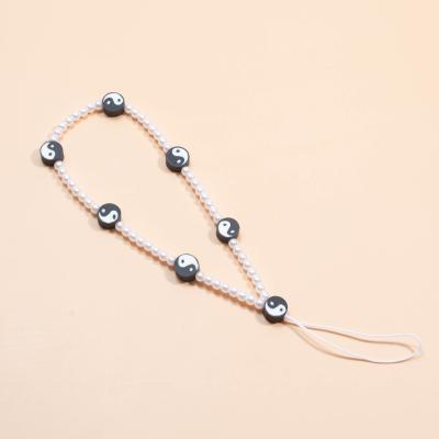 China Hot Fashionable Latest Design Phone Chain Pearl Accessories Yinyang Pearl Keychain Pretty For Women Girls for sale