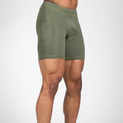 China Custom Gym Mens Fitness Breathable Polyester Spandex Compression Stretch Shorts With Pockets for sale