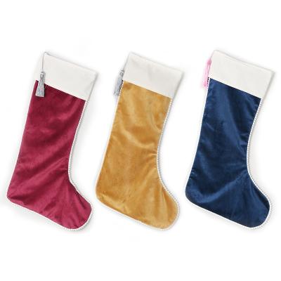 China Velvet Christmas Stockings Velvet Christmas Stocking Personalized Luxury Velvet Pom Pom Christmas Stockings With Tassel Hot Seller for sale