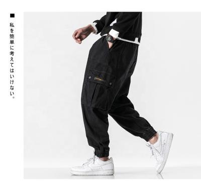 China Vintage Anti-pilling Multi Bag Suits Springs Street Fashion Brand Soft Gaiters Fashion Closure Pants For Men for sale