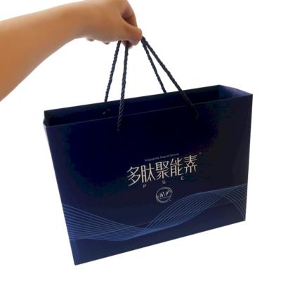 China Wholesale Cheap Recyclable Custom Fashion Luxury Blue Paper Bag With Handle For Healthcare Gift Packaging for sale