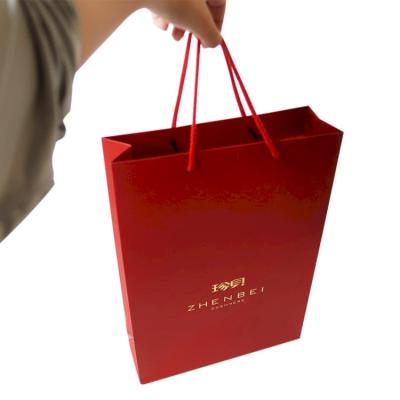 China China Manufacturer Gold Silver Hot Stamping Recyclable Best Price Foil Luxury Generous Red Paper Bag for sale