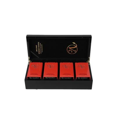 China Glossy Black Handmade Stamping Logo Tea Box Organizer Wood Storage Tops 4 Compartments Can Packing Box for sale