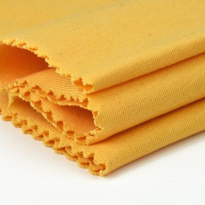 China Isatis Shrink-Resistant Yellow Cotton Plain Jersey Fabric Manufacturers for sale