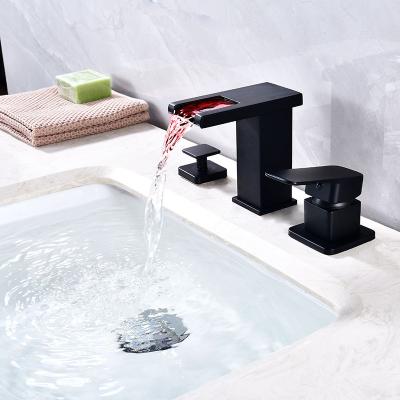 China Metered Faucets Black Waterfall Outlet Three-Hole Bathroom Faucet With Constant Temperature Light Heating And Cooling Adjustment for sale