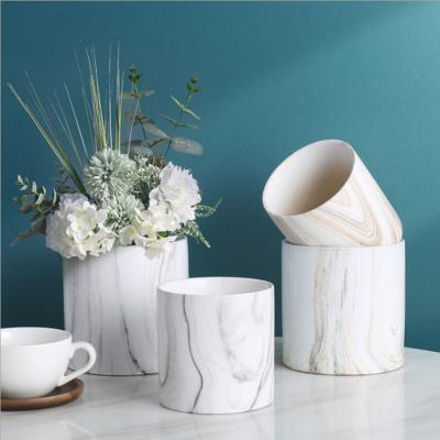 China Europe cheap round cylinder flower pot simple Nordic marble ceramic planter for flower home decor for sale